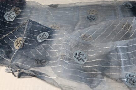Organza Zari Saree in dark grey in light shade color in beautiful waves of full saree view