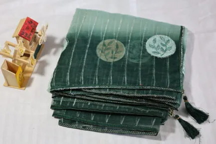 Organza Zari Saree in dark green in light shade color in beautiful wrap