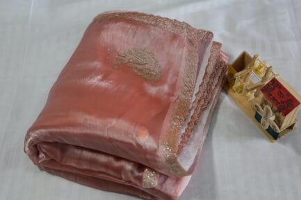 Jimmy Choo Golden Zari Saree beautiful peach color in folded wrap in a beutiful bg