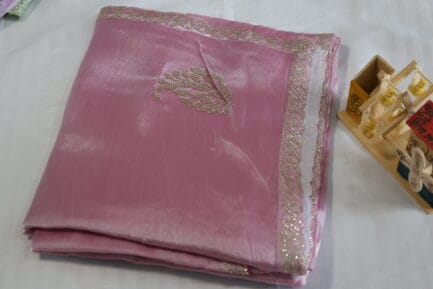 Jimmy Choo Golden Zari Saree beautiful pink color in folded wrap in a beutiful bg